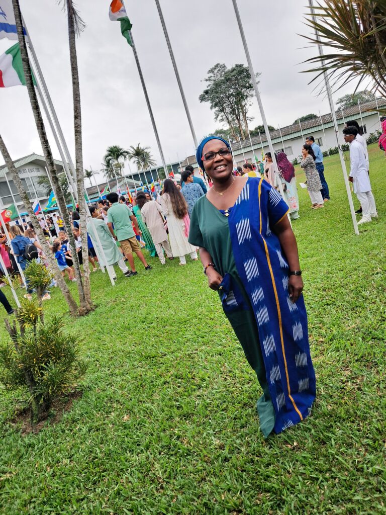 A photo of Ms. Amani at the flag field